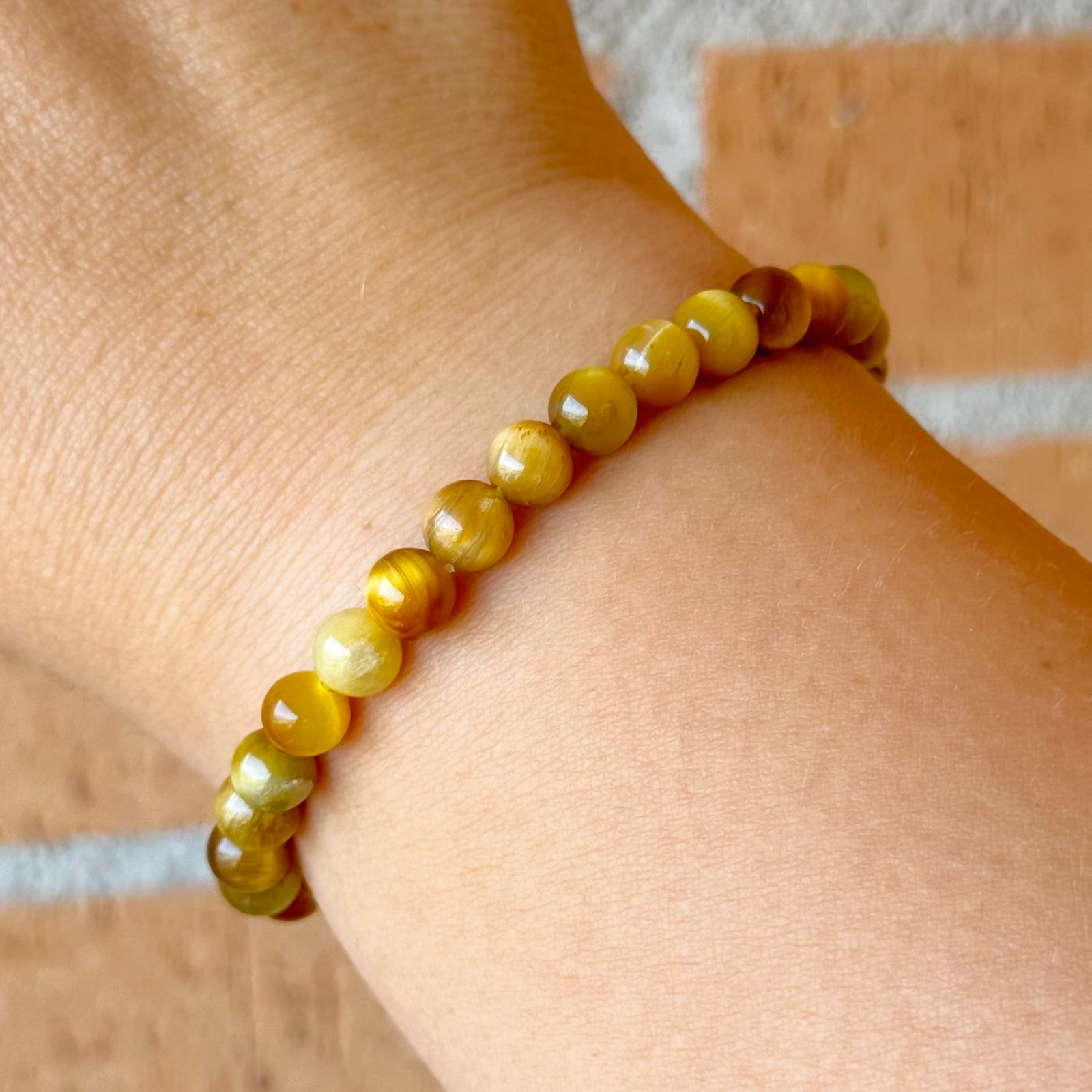 Pulsera bolas ojo de tigre dorado