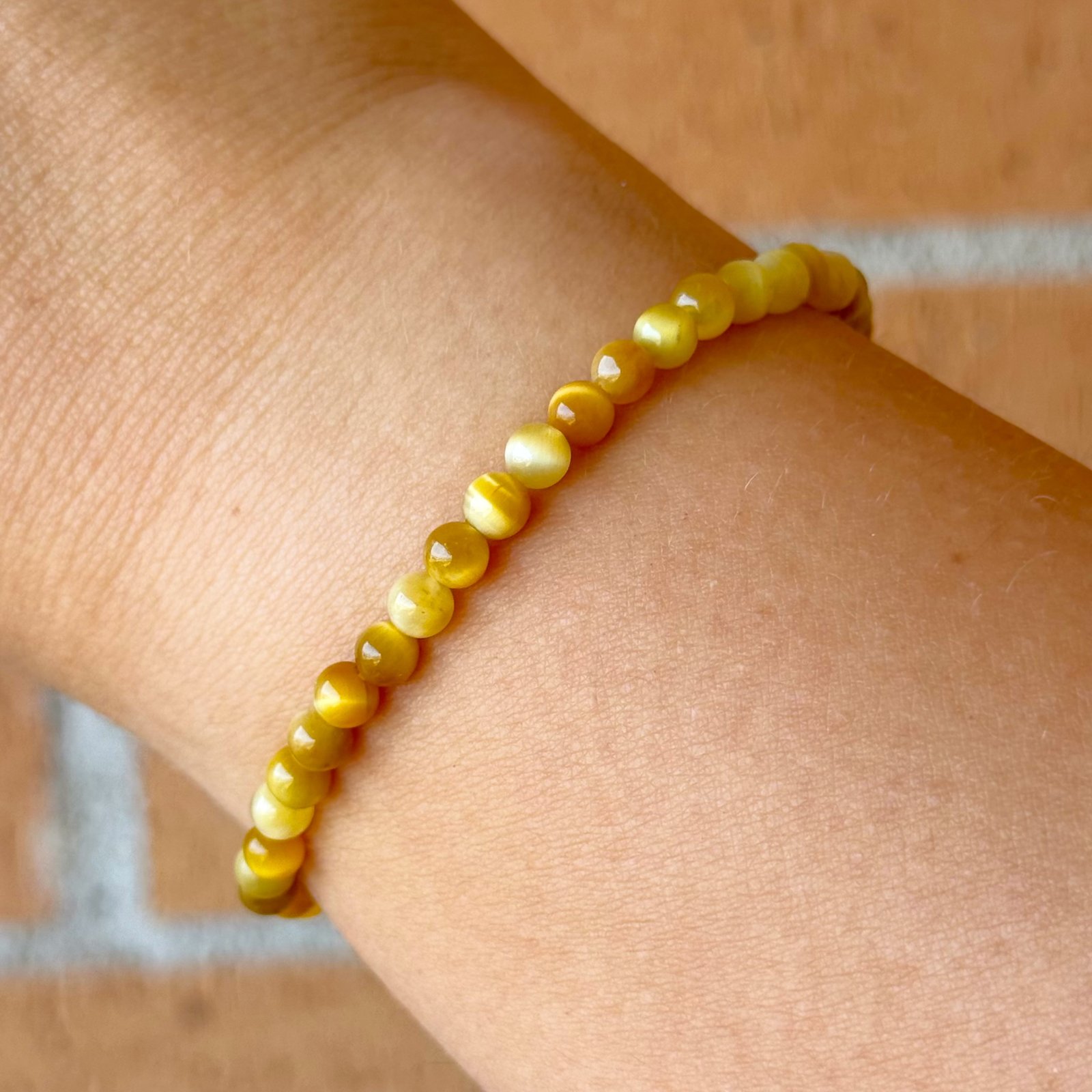 Pulsera bolas ojo de tigre dorado